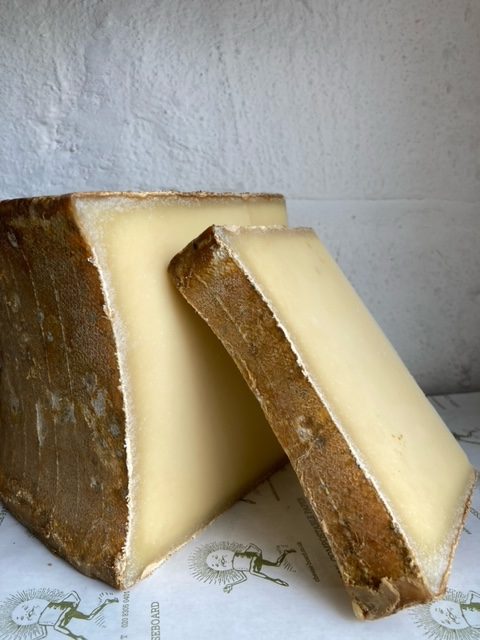 A big piece of beaufort, with another slice leaning against it